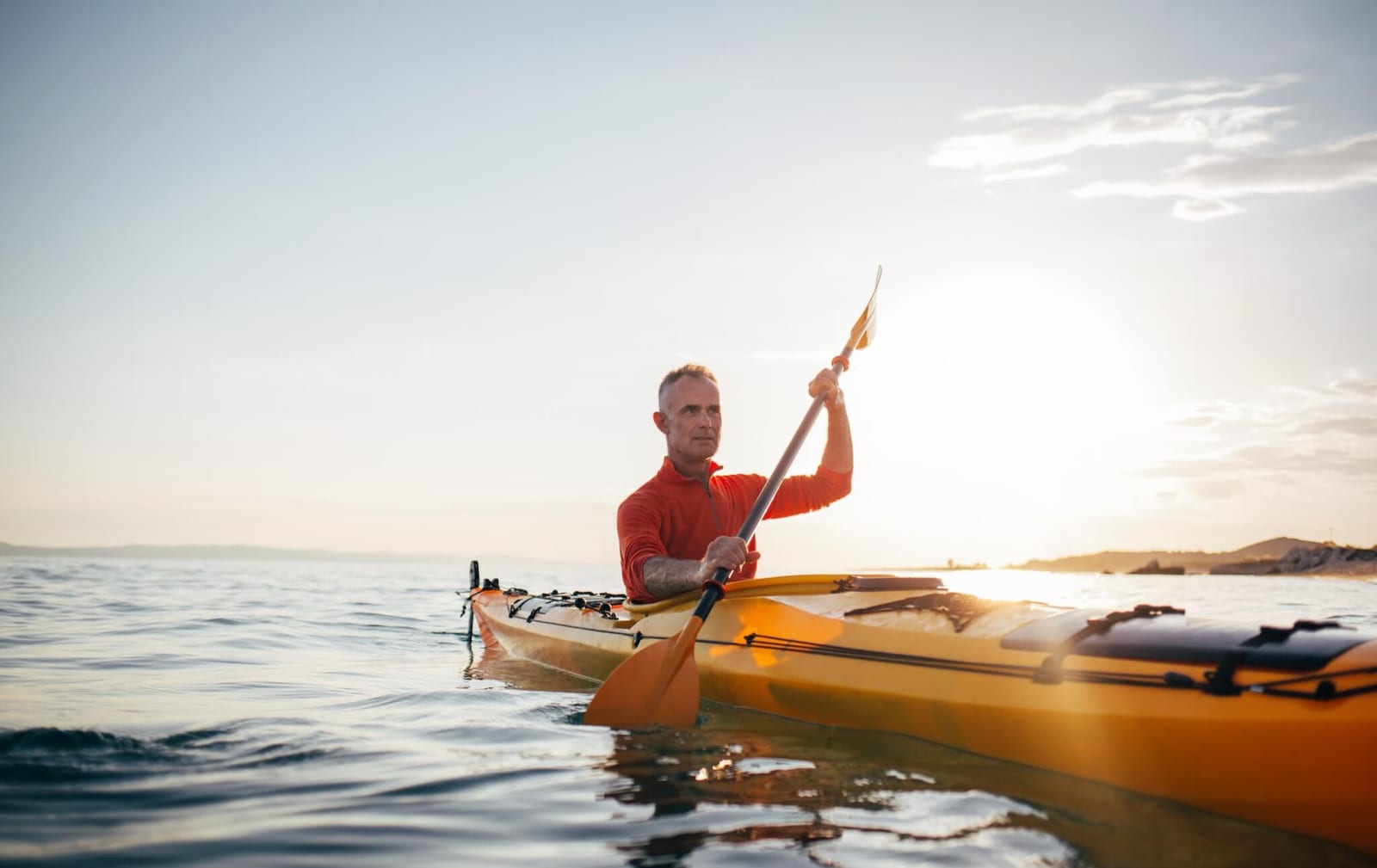 man rowing in a kayak