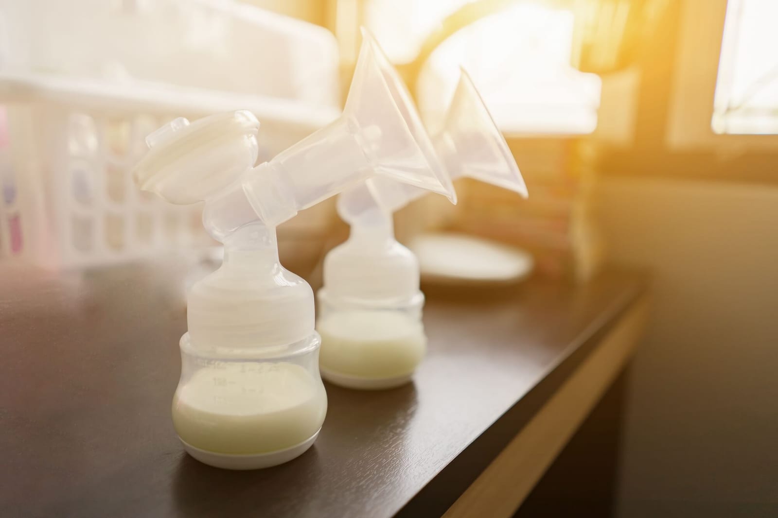 Automatic breast pump, mothers breasts milk is the most healthy food for newborn baby in bed room at home,vintage color