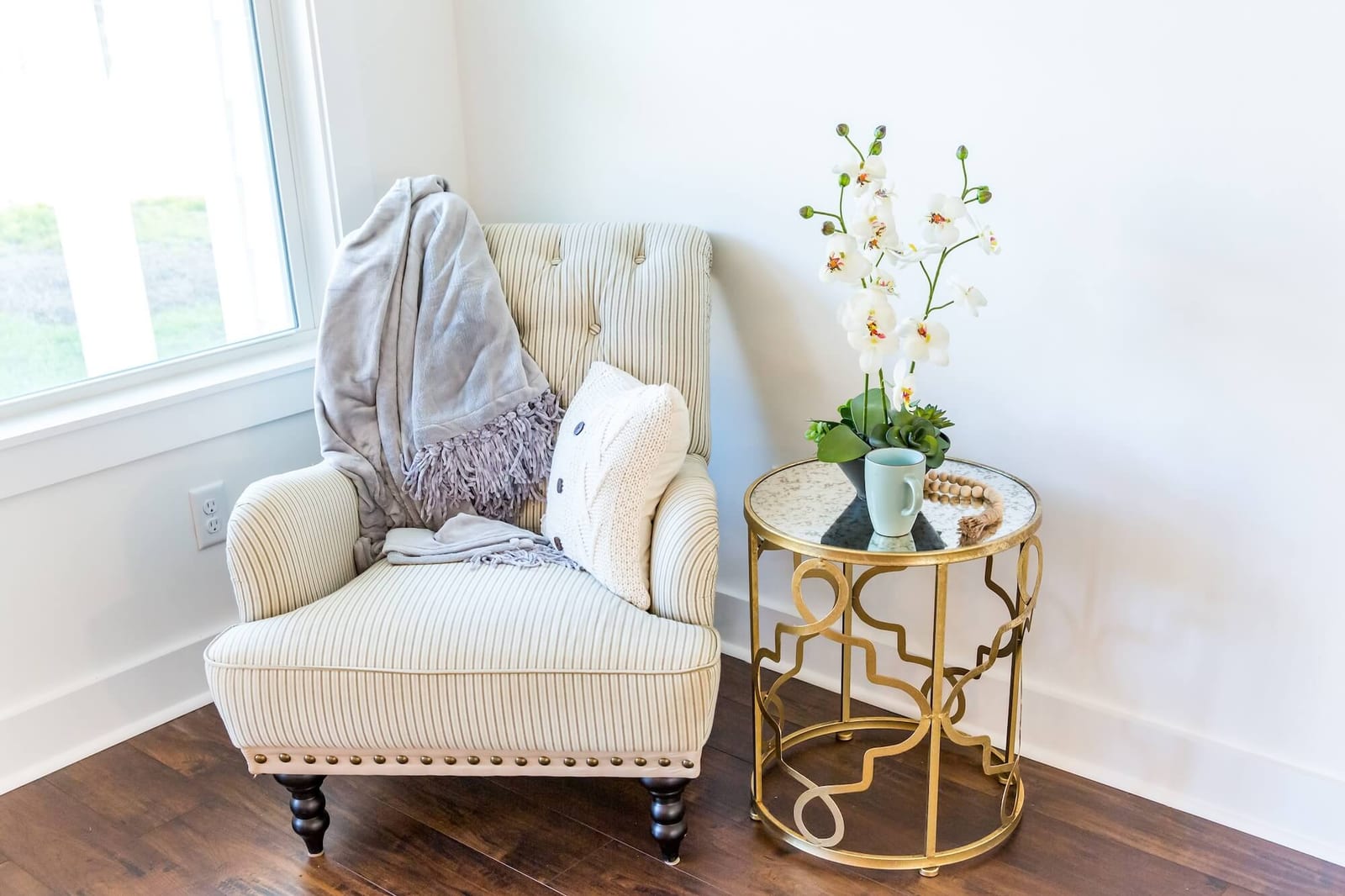 Reading nook corner with an armchair of a new construction house with hardwood floors