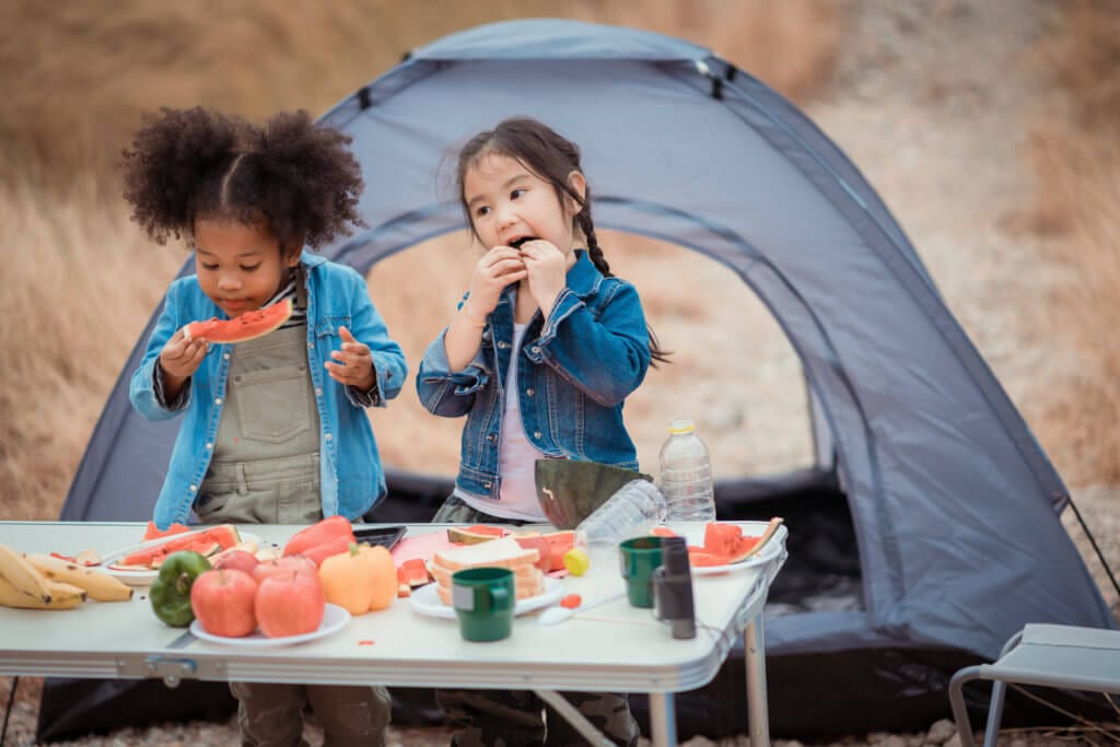 kids eating at the campsite
