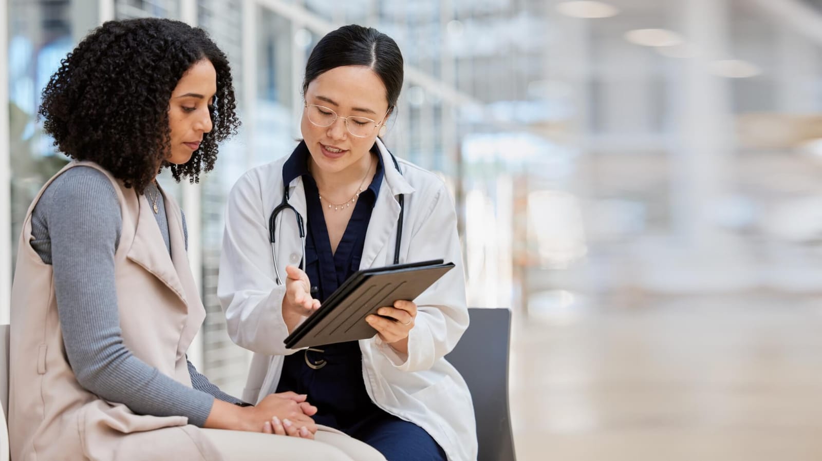 doctor explaining abnormal colon cancer screening results along with the updates guidelines to a patient