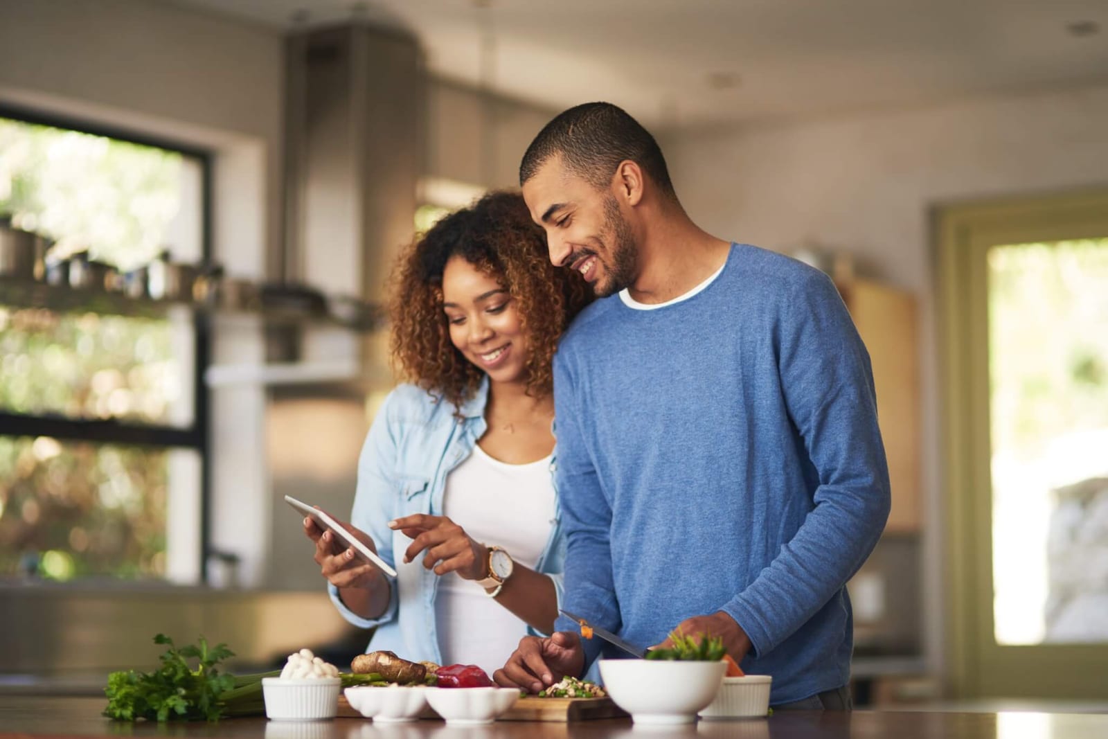 couple cooking a high fiber meal together based on recommendations for maintaining colon health and reducing colorectal cancer risk